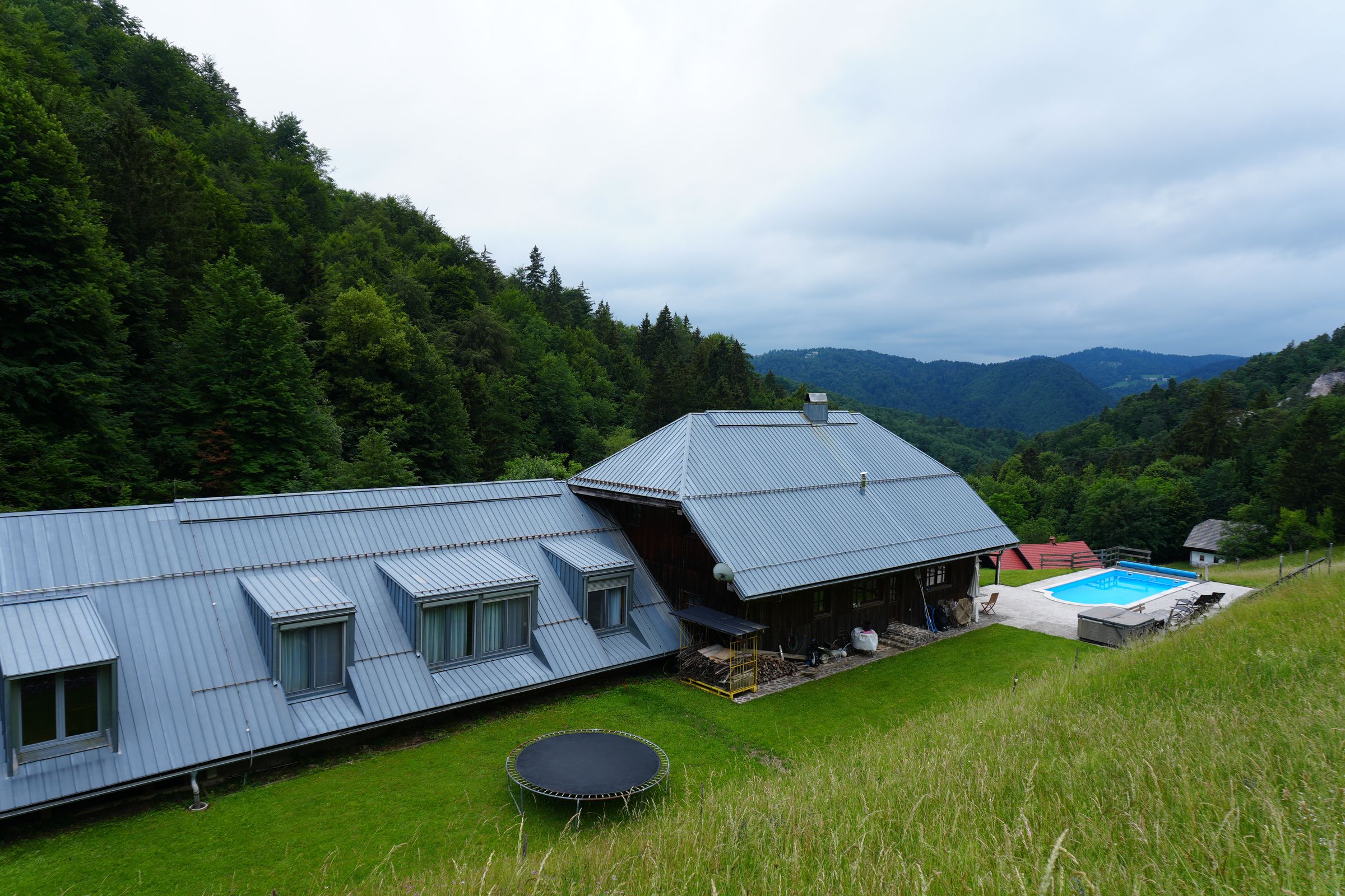 Forest Farmstay with the pool and the valley behind it